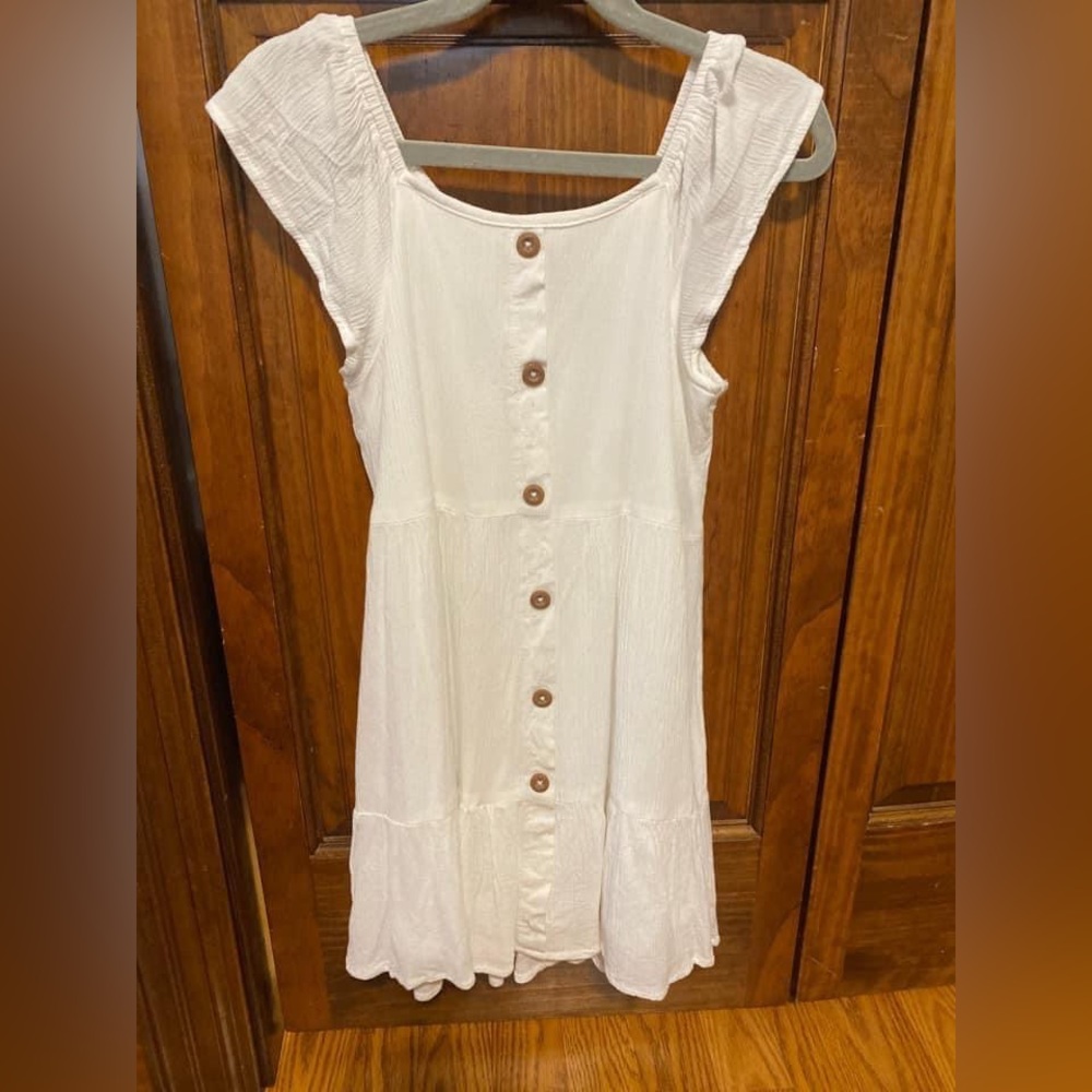 White dress with no functional buttons